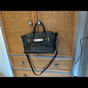 Black used leather coach bag. Very clean like new.